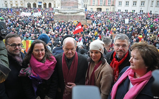Chancellor Scholz and Foreign Minister Baerbock attending a rally in Potsdam
